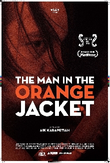 The Man In The Orange Jacket